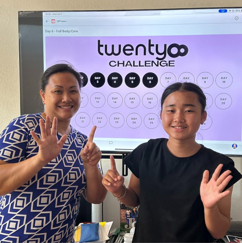 Two members ticking off the twenty8 challenge calendar